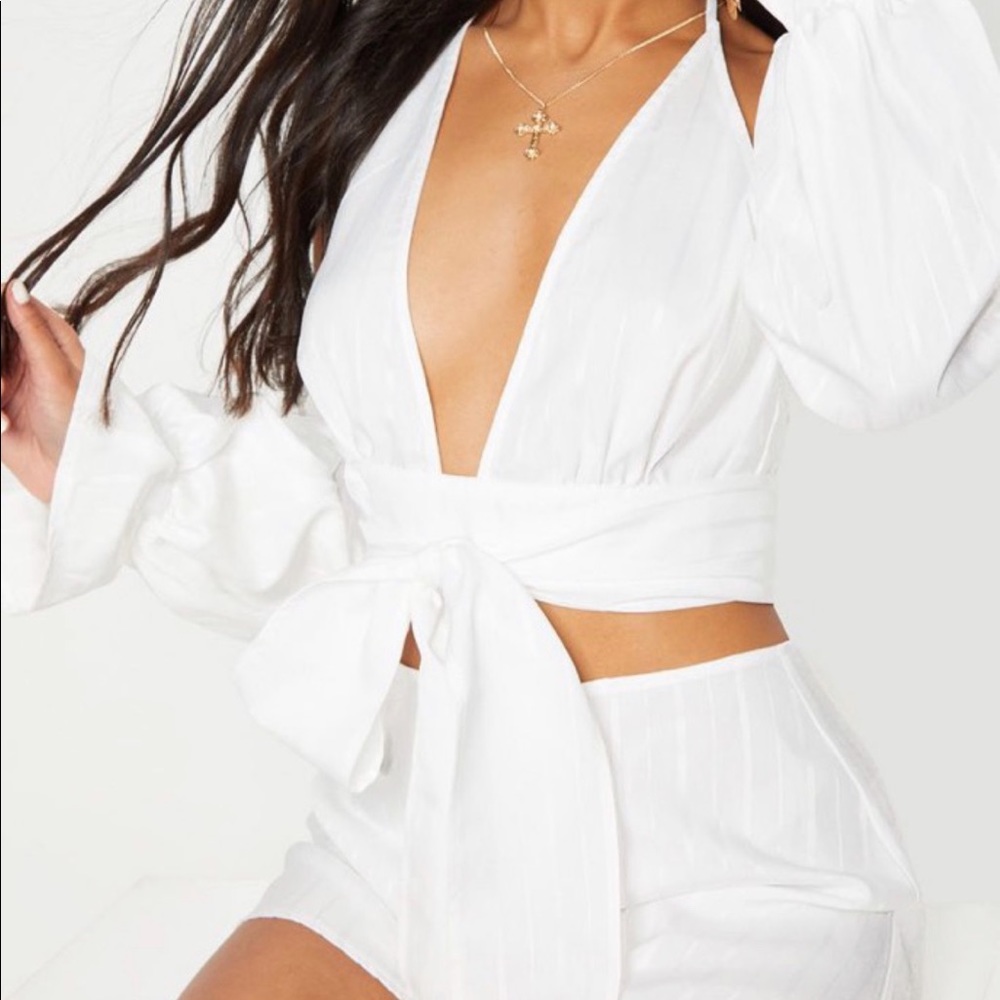 Intricate detail white tie long sleeve top